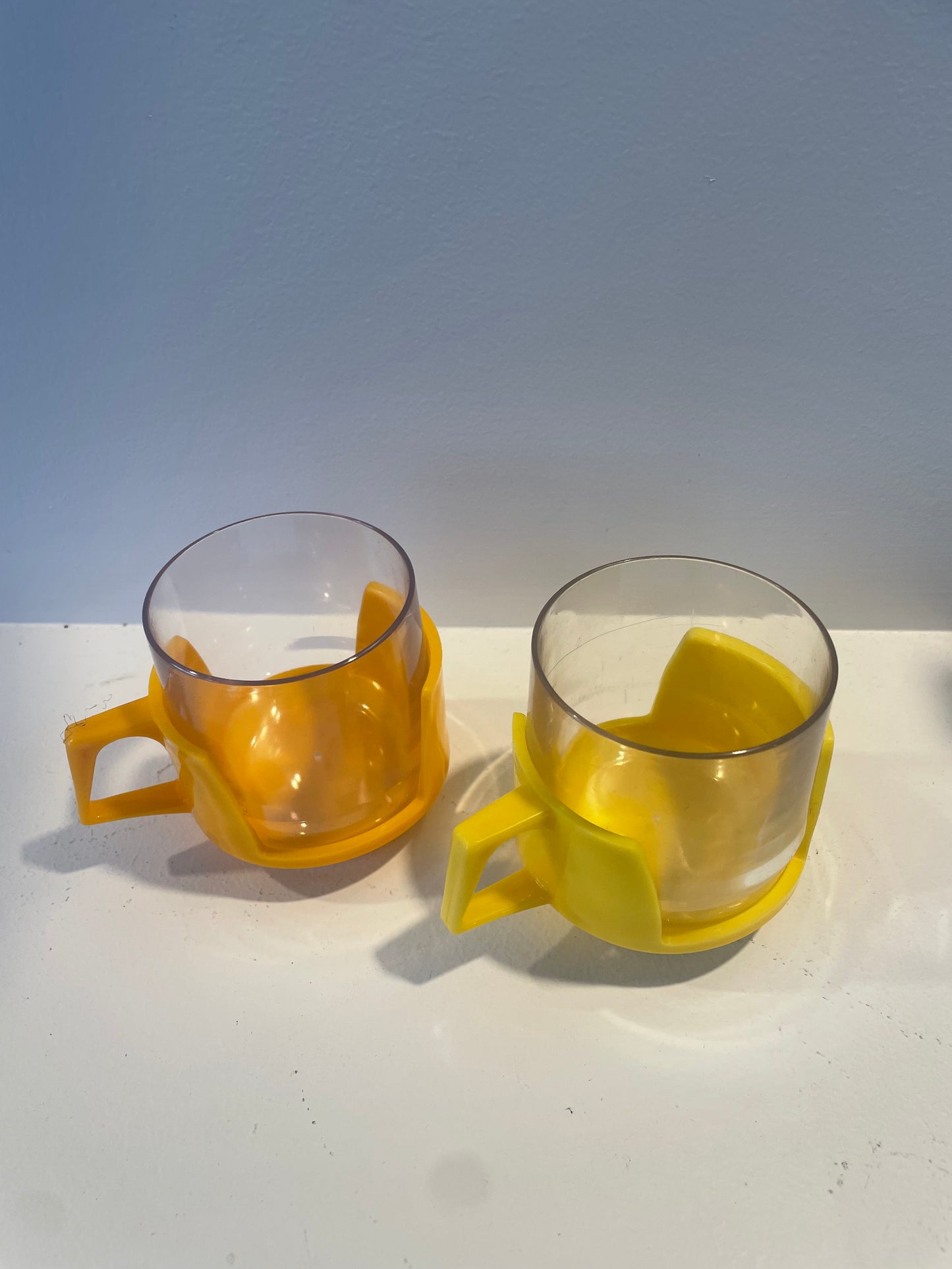 Yellow and Orange Plastic Bodum Style Mugs