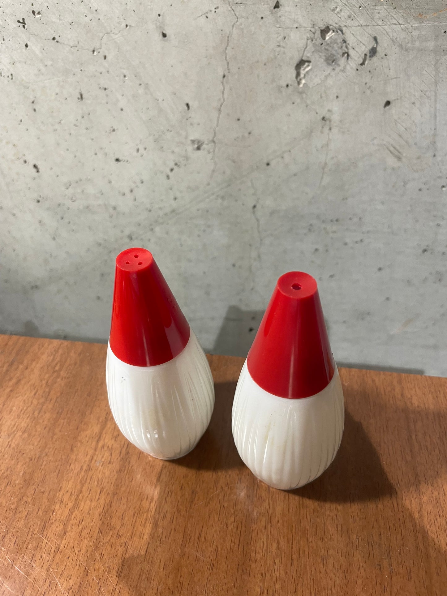 Milk Glass and Red Bakelite Salt and Pepper Shakers